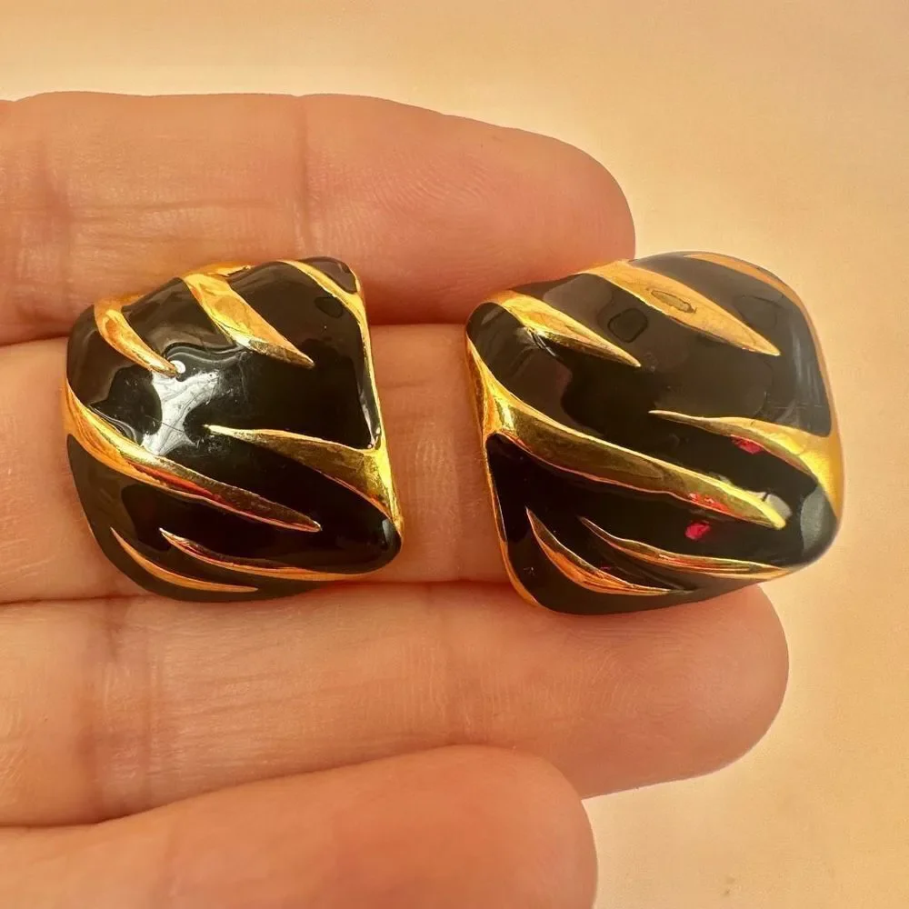 Gold tone and black square post earrings